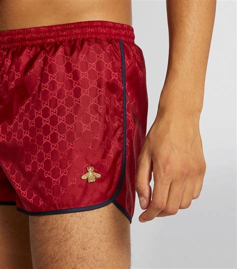 Mens Gucci red GG Supreme Bee Swim Shorts 